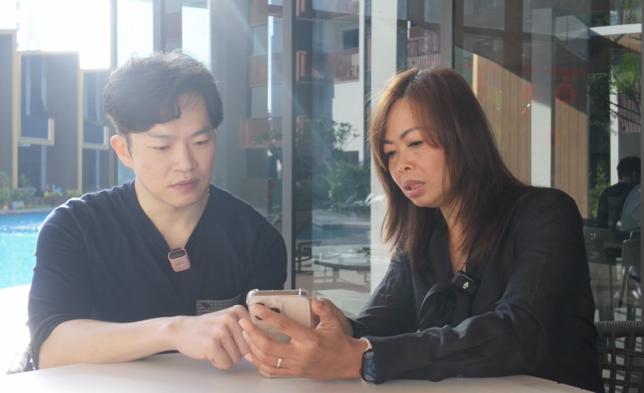 Esther Ng going through upgrading numbers with a client